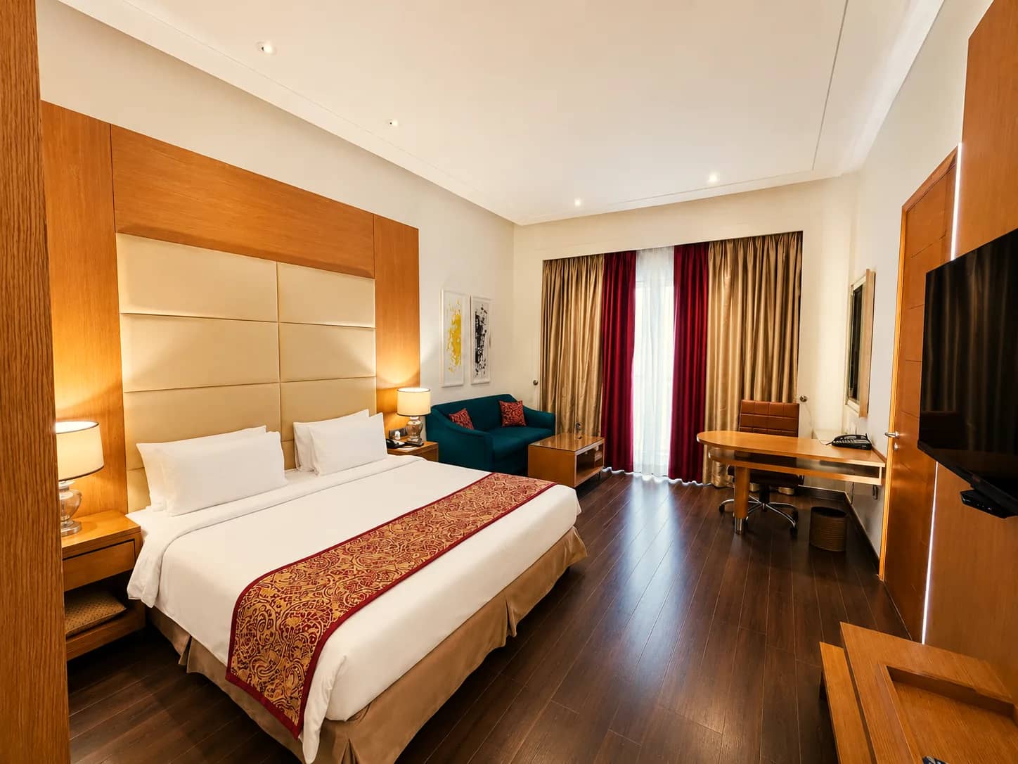 The Deluxe Room with its writing desk and sitting corner