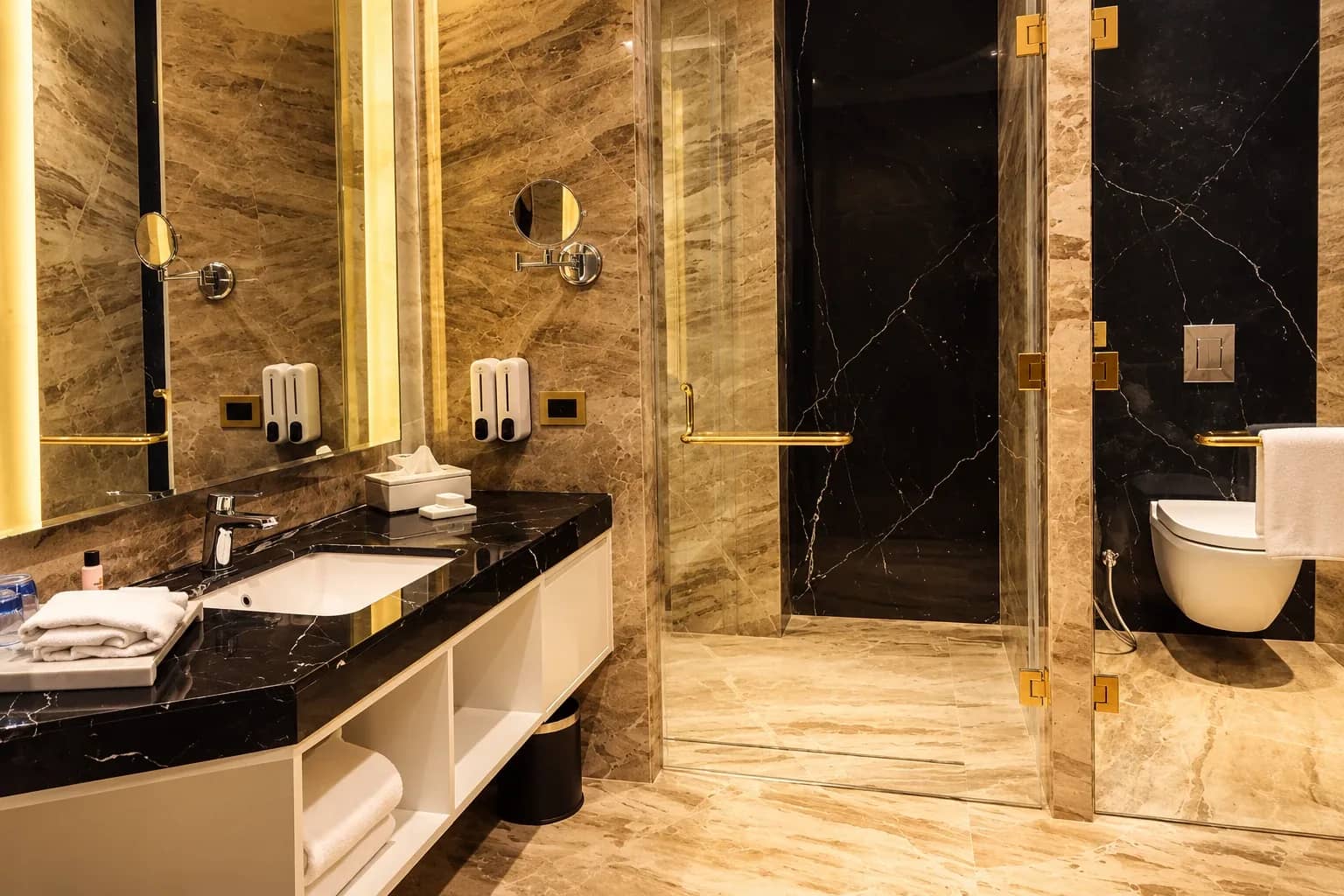 Marble bathroom with a glass-walled shower