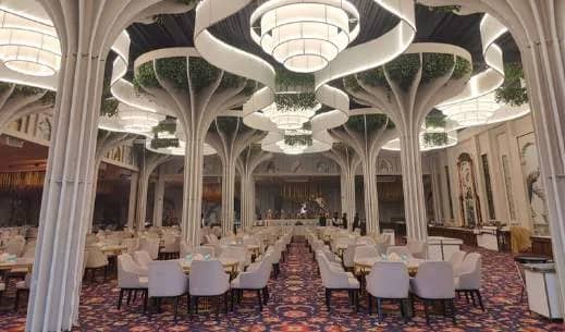 Courtis ballroom with its sculpted white ceiling and chandeliers