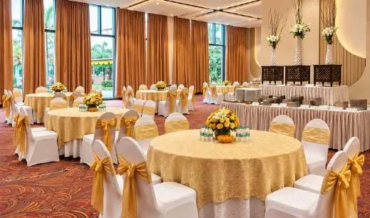Poolside Hall set for a lunch with round tables