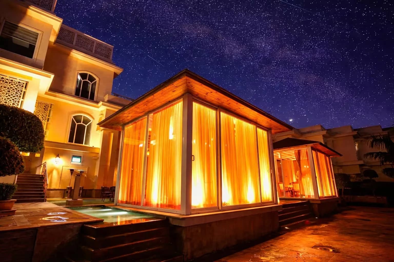A private cabana at Raajsik, lit up at night
