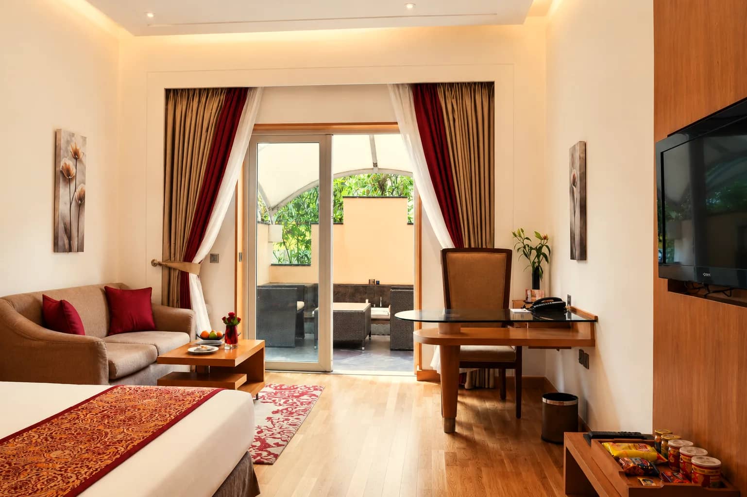 Executive Room with king bed, sitting area and doors to the private terrace