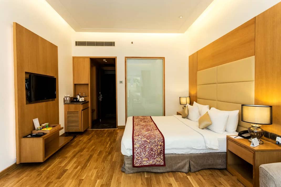 Executive Room with king bed and wood-panelled walls