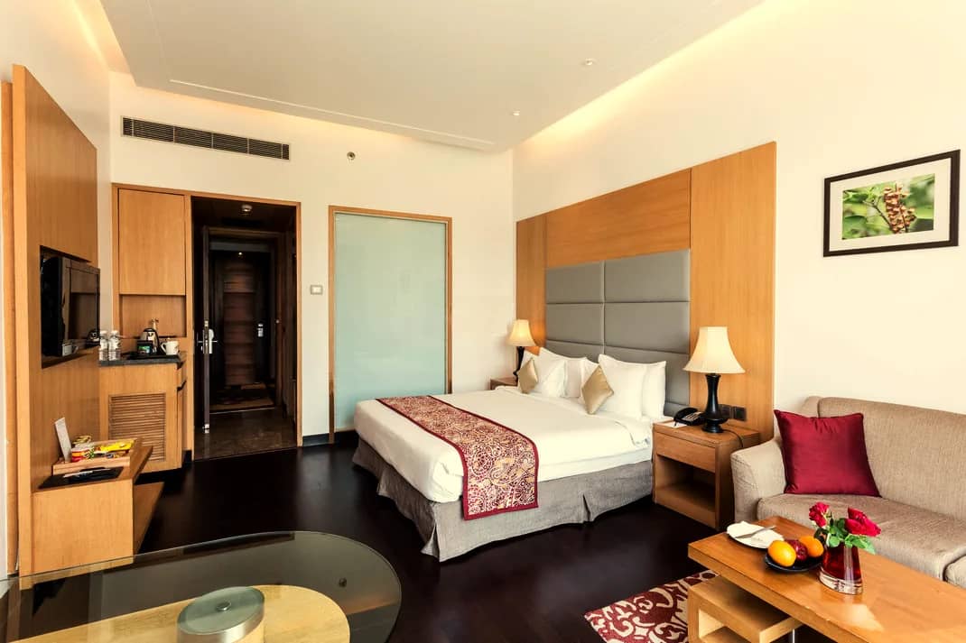 Superior Room sitting area beside the bed