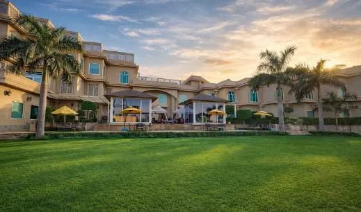 Alameda lawn in front of The Umrao at sunset
