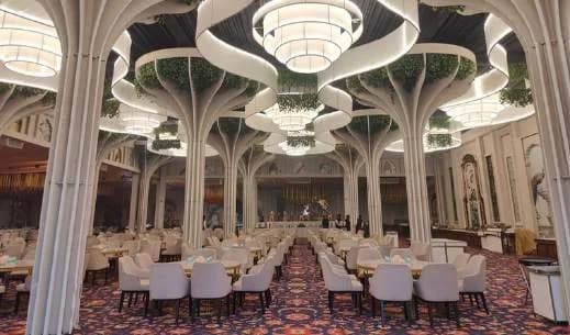 Courtis ballroom with its sculpted white ceiling and chandeliers